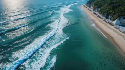 Serene Aerial View of Coastal Waves and Shoreline Under Bright Blue Sky