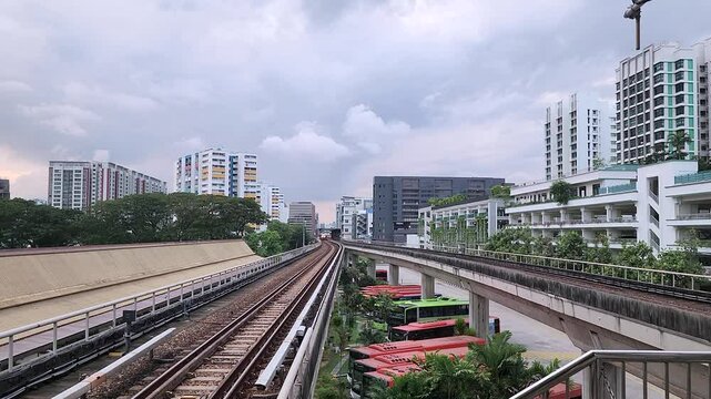 An SMRT train arrives at the Eunos MRT Station on the East-West line in Singapore.