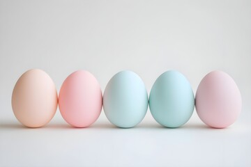 Fototapeta premium pastel easter eggs in a row on white background