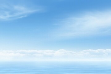 Obraz premium Serene Blue Sky and Ocean Reflection with Soft White Clouds Above