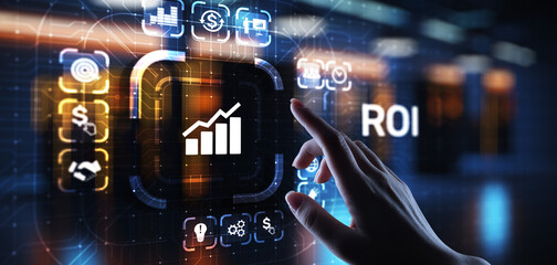 ROI Return on investment reading revenue business concept on virtual screen.