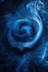 Naklejka premium A swirling cloud of blue smoke on a black background