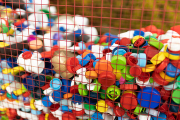 Colorful plastic caps gathered for recycling purposes