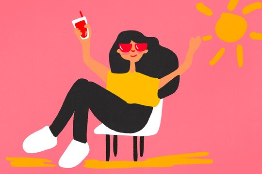 Young woman relaxing in the sun with a drink on a pink background