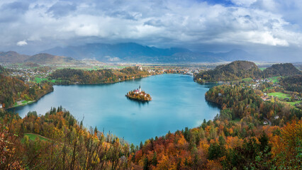 This stunning  view of Lake Bled captures its turquoise waters, a picturesque island, a historic...