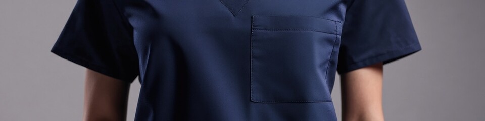 Fototapeta premium A woman is depicted wearing a blue dress with a pocket, ideal for capturing moments or carrying small items