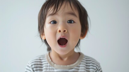 "Baby's surprised expression in portrait orientation."