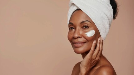 The image shows a woman applying face mask