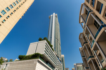 Low angle view to skyscrapers in Dubai, UAE.