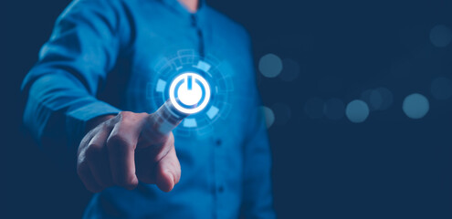 Businessman pressing power button concept. Digital technology touch screen. Hardware equipment...