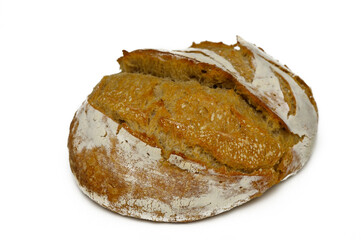 Freshly baked artisanal bread resting on a minimalist white surface