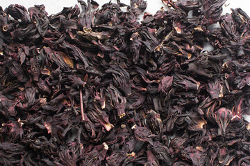 Overhead view of dried roselle, top view of dried hibiscus and Sorrel flowers, ingredient for making nigerian zobo drink