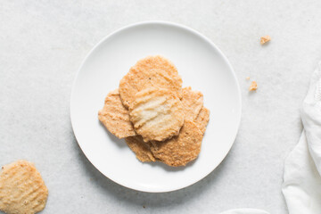 Overhead view of gurundi chips, top view of nigerian coconut biscuits, Nigerian coconut cookies made with coconut and cassava