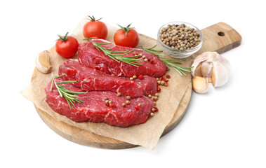 Pieces of raw beef meat, spices and tomatoes isolated on white