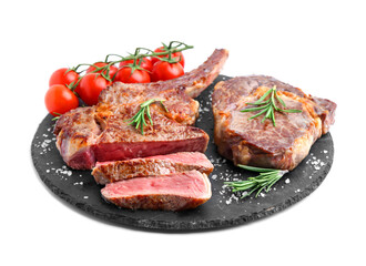 Pieces of delicious beef meat, spices and tomatoes isolated on white