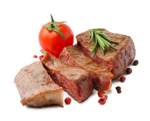 Pieces of delicious beef meat, spices and tomato isolated on white