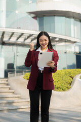 Fototapeta premium Portrait of a successful businesswoman radiating confidence and ambition, inspired by excellent financial results.