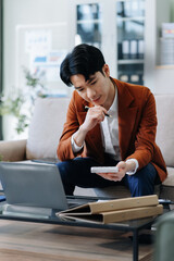 Business and financial concepts about office work. Analysts discuss business with a calculator as a tool...