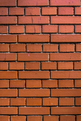 Vibrant red brick wall texture showcasing craftsmanship and architectural details in a rustic environment