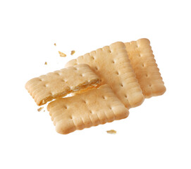 Whole and crushed crispy cookies in the air close-up isolated on white background