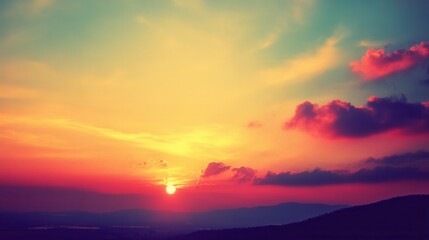 Obraz premium Vibrant Sunset Over Mountains with Colorful Sky and Clouds