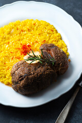 Beef Meat on the bone with Spinal cord in Italian cuisine, a classic recipe of  Ossobuco or Ossbus, Lombard cuisine, served with risotto or polenta and cooked for a long time with vegetables in wine 