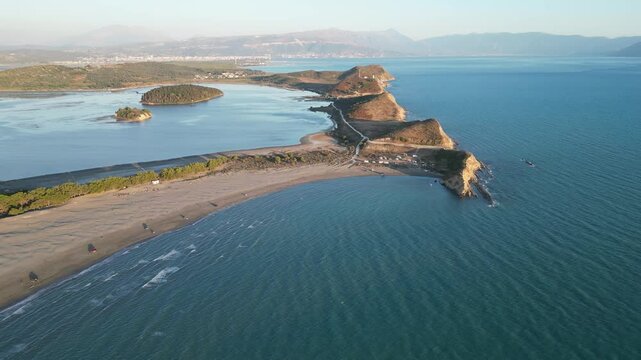 Panoramic view of Zvernec beach or Dalan beach near Vlore with parked campervans or motorhomes. Amazing landscape of Adriatic sea - Albania, Europe.