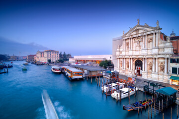 Naklejka premium Venice at sunrise, Italy. View of the Grand Canal at dawn. It is one of the main tourist attractions in Italy. Famous European city.
