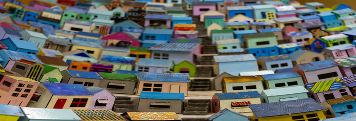 Close-Up View of Colorful Miniature Hillside Village with Stacked Houses and Detailed Architectural Elements