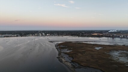 Serene sunset over a winding river, casting warm hues across the landscape