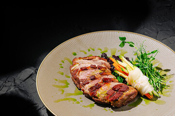 Delicious grilled steak served with fresh vegetables on a plate