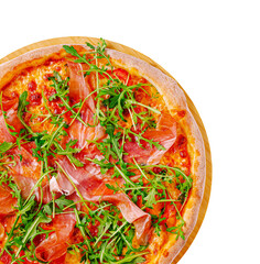 Homemade pizza topped with fresh arugula and prosciutto