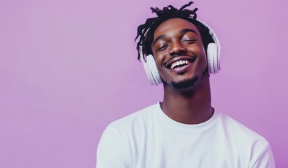 Modern and cool man listening music on headphones with smiley and happy attitude on trendy color background