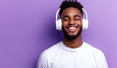 Modern and cool man listening music on headphones with smiley and happy attitude on trendy color background
