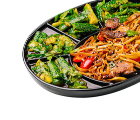 Delicious lunch box featuring noodles, vegetables, and protein