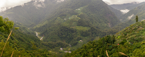 Expansive Green Mountain Valleys with Winding River and Misty Peaks Reflecting Taiwan’s Remote Wilderness and Serenity