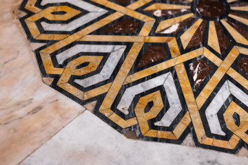 Intricate Geometric Marble Inlay Design with Bold Yellow Patterns