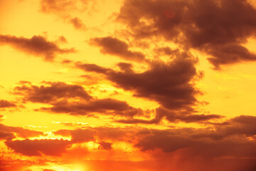 Amazing evening cloudy sky during golden sunset