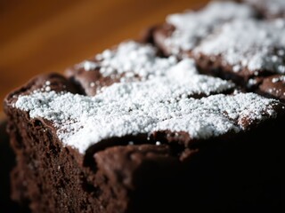 Fototapeta premium Chocolate Brownie Dessert with Powdered Sugar