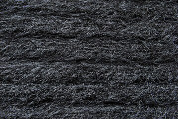 Black chunky fluffy wool jersey fabric texture as background
