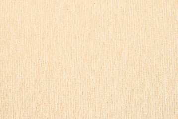 A sheet of beige structure recycled cardboard texture as background