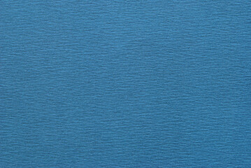 A sheet of blue creased effect cardboard texture as background