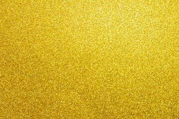 Golden glitter paper texture as background