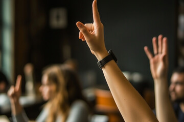 group of people in classroom setting, with hands raised for participation. atmosphere is engaged and interactive, showcasing learning environment