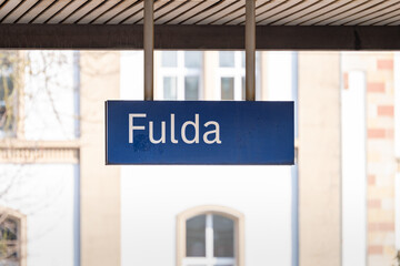 Fulda train station sign. Location name board at the train platform in Germany. Travel destination when using the public transportation services.