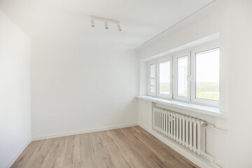 Empty room with white walls, offering a clean and minimalist space ready for decoration or renovation