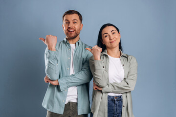 Showing to the side. Man and woman are in the studio