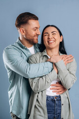 Cute couple having fun. Man and woman are in the studio