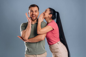 Naklejka premium Gossip time, funny couple. Man and woman are in the studio