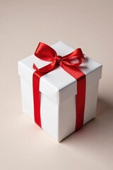 Fototapeta premium Small white gift box wrapped in red ribbon and twine, wrapping paper, present